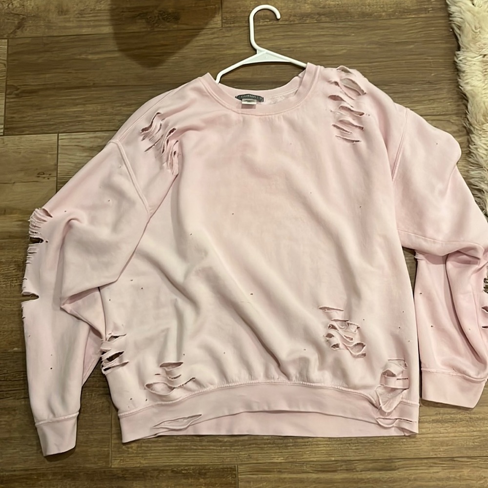 Woman’s distressed pink crew neck